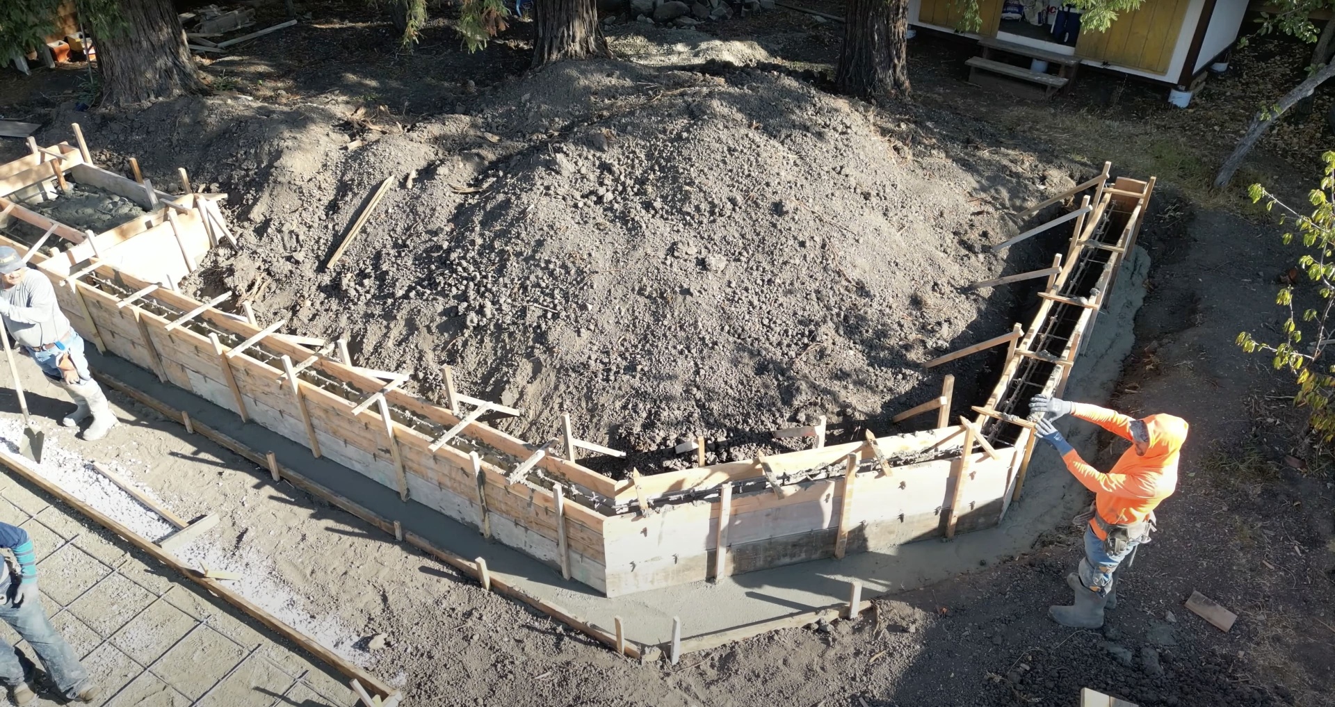 Foundation concrete work with proper forming and reinforcement Concrete foundation construction with wooden forms and rebar reinforcement preparation